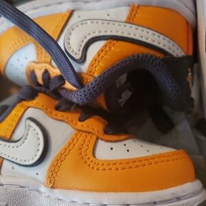 Nike Orange and White Sneakers with Breathable Design
